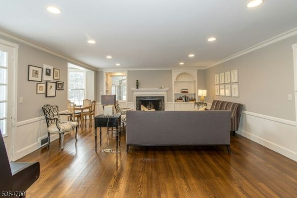 Dining room, Fireplace, Interior, Living room, Recessed Lighting, Wood Texture Flooring