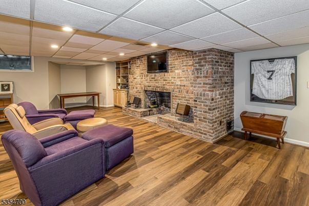 Fireplace, Interior, Living room, Recessed Lighting, Stone Walls, Wood Texture Flooring