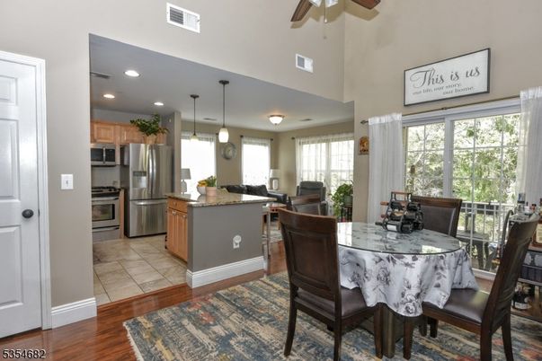 Dining room, Interior, Kitchen, Pendant Lights, Recessed Lighting, Stainless Steel Appliances, Wood Texture Flooring