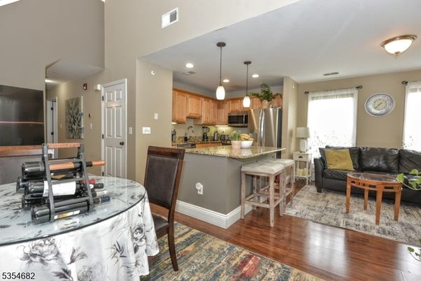 Dining room, Interior, Kitchen, Living room, Pendant Lights, Recessed Lighting, Stainless Steel Appliances, Wood Texture Flooring
