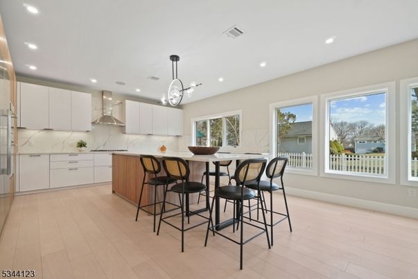 Interior, Kitchen, Marble Walls, Pendant Lights, Recessed Lighting, Wood Texture Flooring