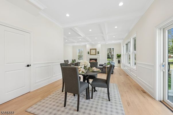 Dining room, Fireplace, Interior, Living room, Recessed Lighting, Wood Texture Flooring