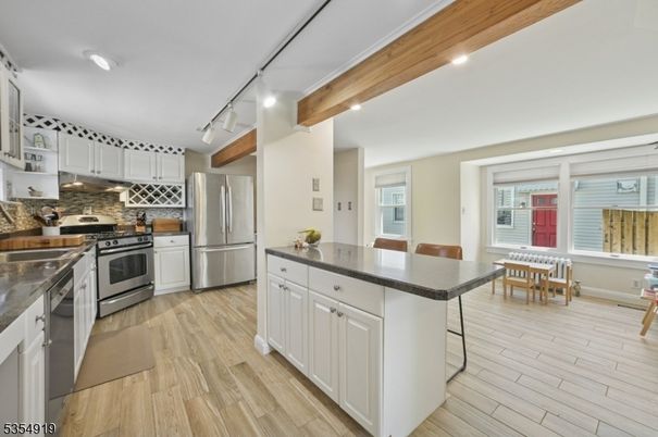 Dining room, Interior, Kitchen, Recessed Lighting, Stainless Steel Appliances, Wooden Beams, Wood Texture Flooring
