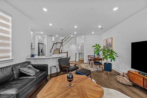 Dining room, Interior, Kitchen, Living room, Recessed Lighting, Stainless Steel Appliances, Wood Texture Flooring