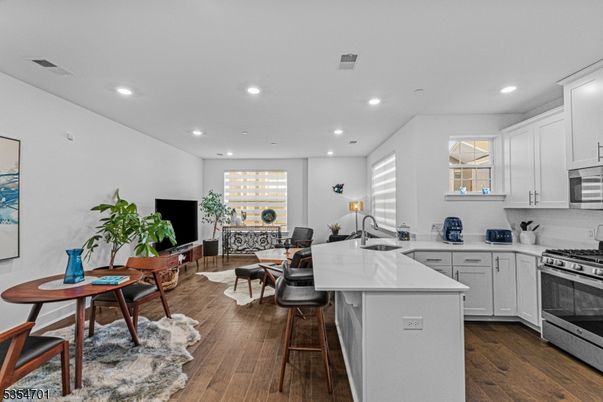 Dining room, Interior, Kitchen, Recessed Lighting, Stainless Steel Appliances, Wood Texture Flooring