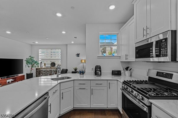 Dining room, Interior, Kitchen, Recessed Lighting, Stainless Steel Appliances, Wood Texture Flooring
