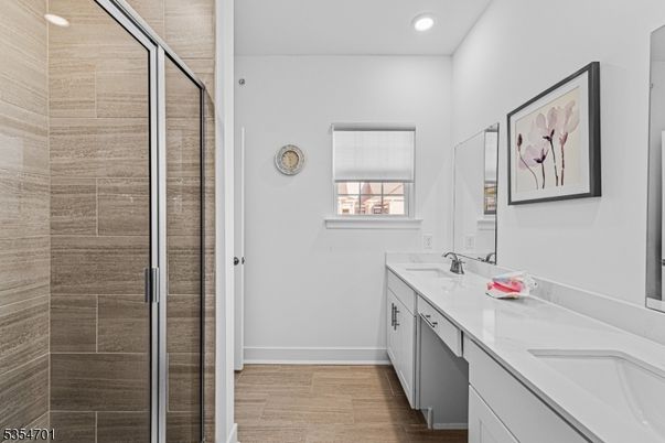 Bathroom, Dual Sink Vanities, Glass Shower, Interior, Recessed Lighting, Wood Texture Flooring