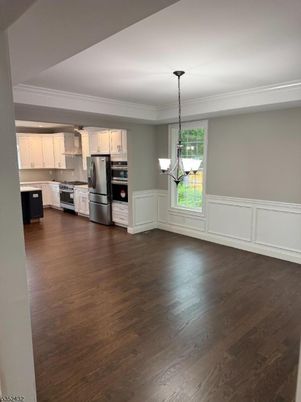Chandelier, Empty room, Interior, Kitchen, Pendant Lights, Stainless Steel Appliances, Wood Texture Flooring