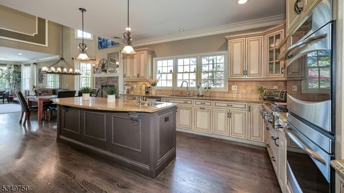 Chandelier, Dining room, Interior, Kitchen, Pendant Lights, Recessed Lighting, Stainless Steel Appliances, Wood Texture Flooring
