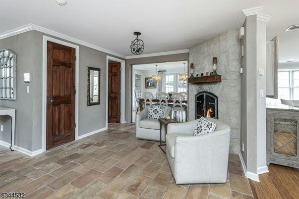 Chandelier, Dining room, Fireplace, Interior, Living room, Pendant Lights, Stone Walls