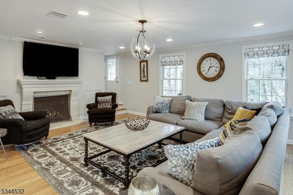 Chandelier, Fireplace, Interior, Living room, Recessed Lighting, Wood Texture Flooring