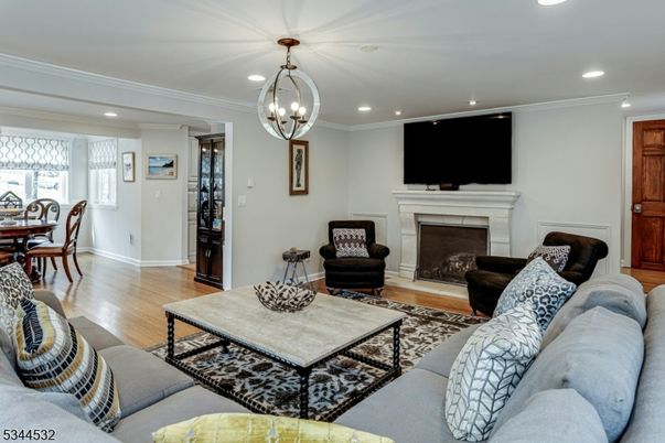 Chandelier, Dining room, Fireplace, Interior, Living room, Recessed Lighting, Wood Texture Flooring