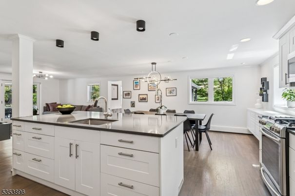 Chandelier, Dining room, Interior, Kitchen, Pendant Lights, Recessed Lighting, Stainless Steel Appliances, Wood Texture Flooring