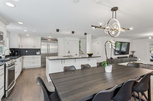 Dining room, Interior, Kitchen, Pendant Lights, Recessed Lighting, Stainless Steel Appliances, Wood Texture Flooring