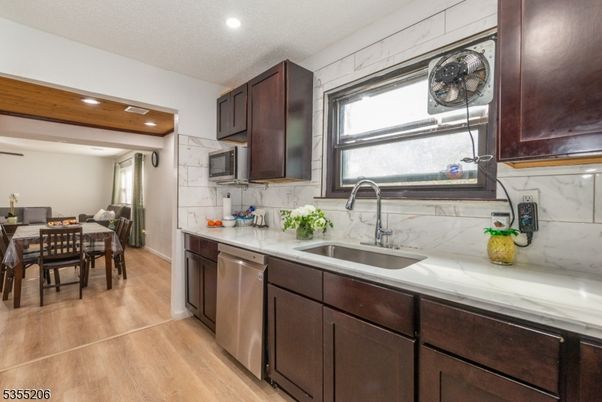 Dining room, Interior, Kitchen, Recessed Lighting, Stainless Steel Appliances, Wood Texture Flooring