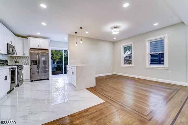 Interior, Kitchen, Marble, Pendant Lights, Recessed Lighting, Stainless Steel Appliances, Wood Texture Flooring