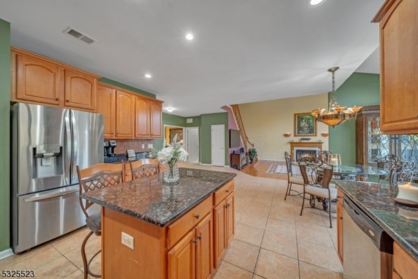 Chandelier, Dining room, Fireplace, Interior, Kitchen, Recessed Lighting, Stainless Steel Appliances