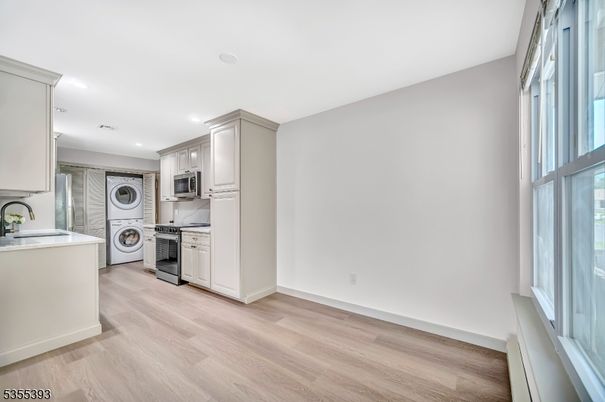 Interior, Kitchen, Recessed Lighting, Stainless Steel Appliances, Washer, Wood Texture Flooring