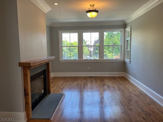 Empty room, Fireplace, Interior, Recessed Lighting, Wood Texture Flooring