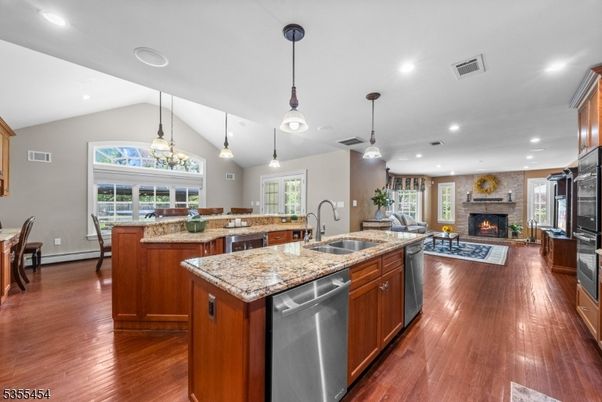 Dining room, Fireplace, Interior, Kitchen, Living room, Pendant Lights, Recessed Lighting, Stainless Steel Appliances, Wood Texture Flooring