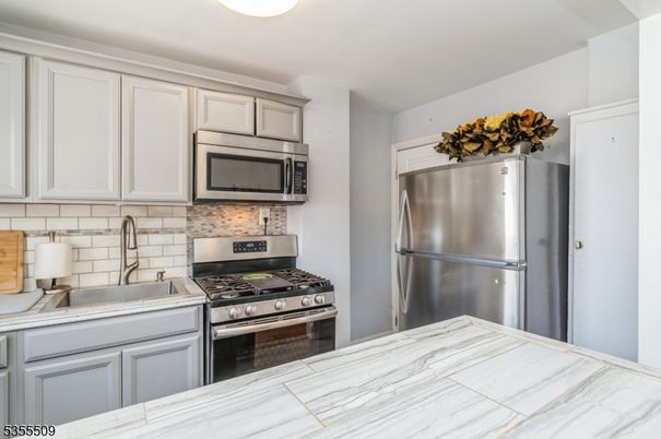 Interior, Kitchen, Stainless Steel Appliances, Tile Countertops