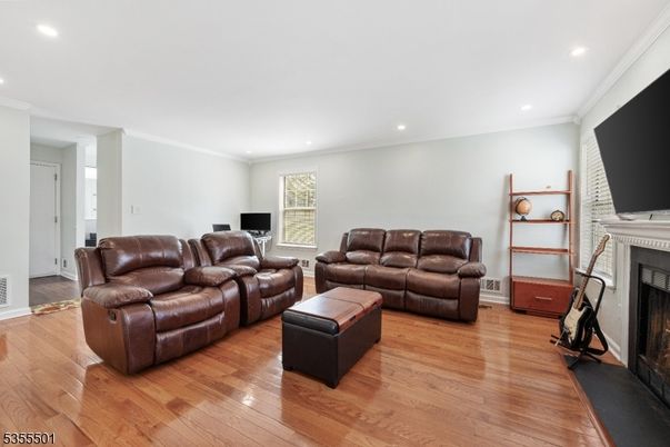 Fireplace, Interior, Living room, Recessed Lighting, Wood Texture Flooring