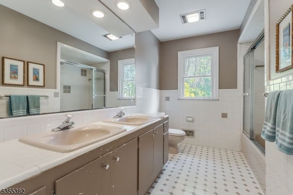 Bathroom, Dual Sink Vanities, Glass Shower, Interior, Recessed Lighting, Tile Countertops