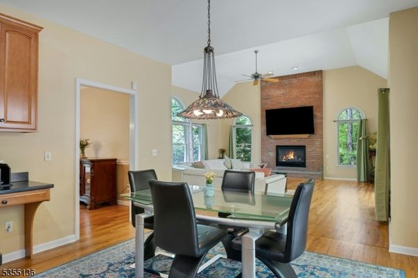 Dining room, Fireplace, Interior, Pendant Lights, Recessed Lighting, Stone Walls, Wood Texture Flooring