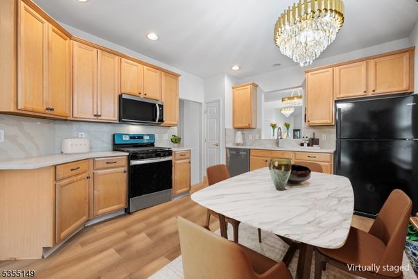 Chandelier, Dining room, Interior, Kitchen, Recessed Lighting, Stainless Steel Appliances, Wood Texture Flooring
