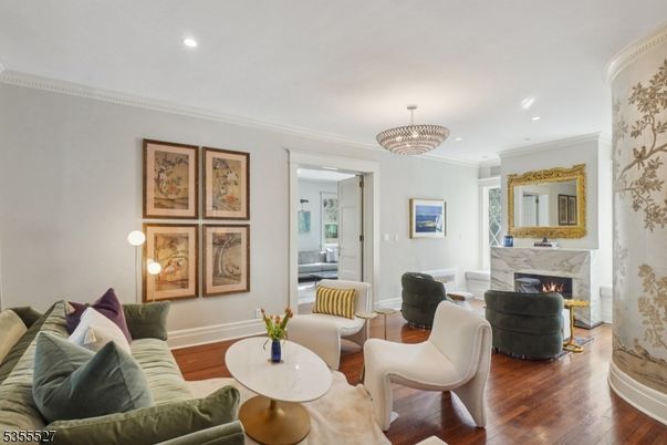 Chandelier, Fireplace, Interior, Living room, Recessed Lighting, Wood Texture Flooring