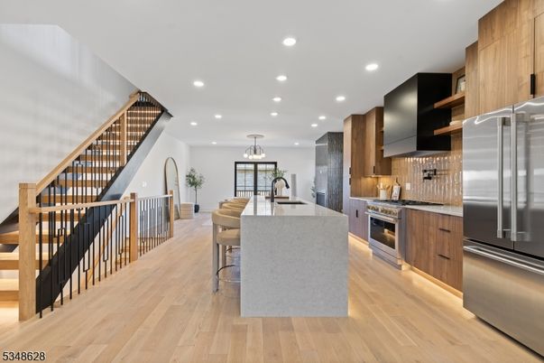 Dining room, Interior, Kitchen, Pendant Lights, Recessed Lighting, Stainless Steel Appliances, Wood Texture Flooring