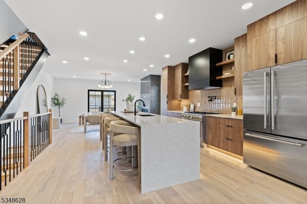 Chandelier, Dining room, Interior, Kitchen, Pendant Lights, Recessed Lighting, Stainless Steel Appliances, Wood Texture Flooring
