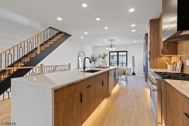Chandelier, Interior, Kitchen, Pendant Lights, Recessed Lighting, Stainless Steel Appliances, Wood Texture Flooring