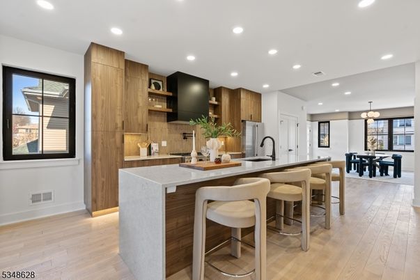 Dining room, Interior, Kitchen, Pendant Lights, Recessed Lighting, Stainless Steel Appliances, Wood Texture Flooring