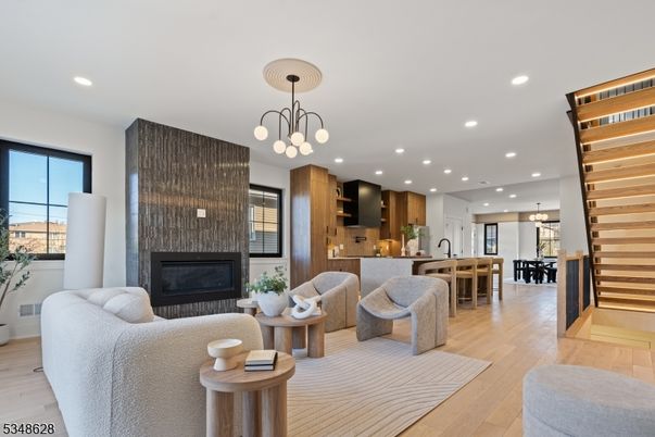 Chandelier, Dining room, Fireplace, Interior, Kitchen, Living room, Pendant Lights, Recessed Lighting, Wood Texture Flooring