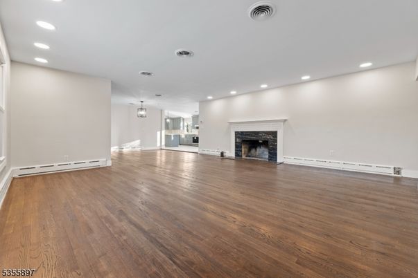 Empty room, Fireplace, Interior, Pendant Lights, Recessed Lighting, Wood Texture Flooring