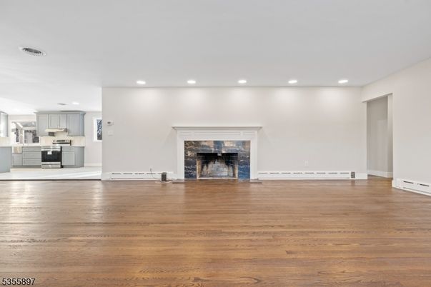 Empty room, Fireplace, Interior, Kitchen, Recessed Lighting, Wood Texture Flooring
