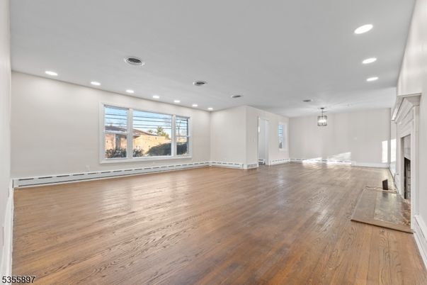 Empty room, Fireplace, Interior, Pendant Lights, Recessed Lighting, Wood Texture Flooring