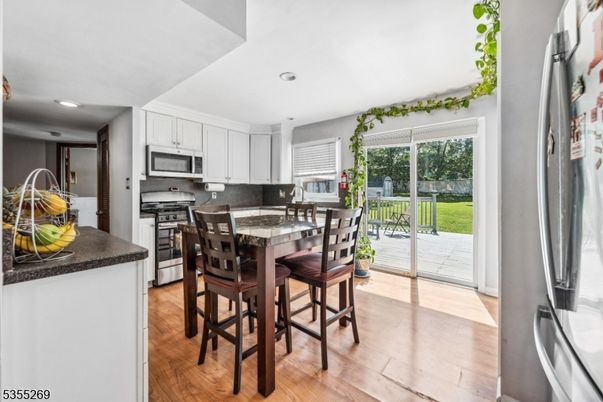 Dining room, Interior, Kitchen, Recessed Lighting, Stainless Steel Appliances, Wood Texture Flooring