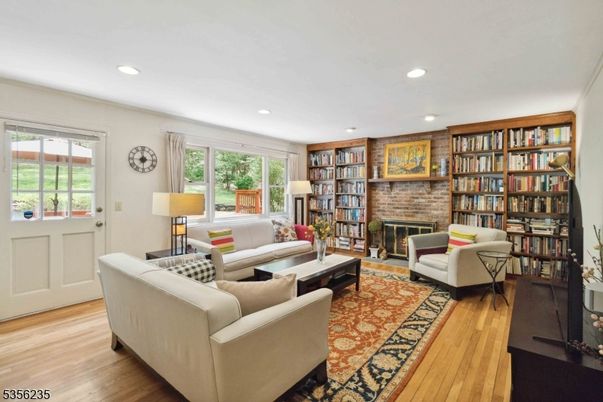 Fireplace, Interior, Living room, Recessed Lighting, Stone Walls, Wood Texture Flooring