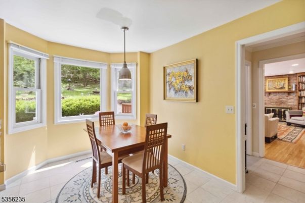 Dining room, Fireplace, Interior, Living room, Pendant Lights, Stone Walls, Wood Texture Flooring