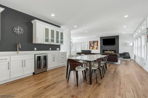 Dining room, Fireplace, Interior, Living room, Recessed Lighting, Wood Texture Flooring