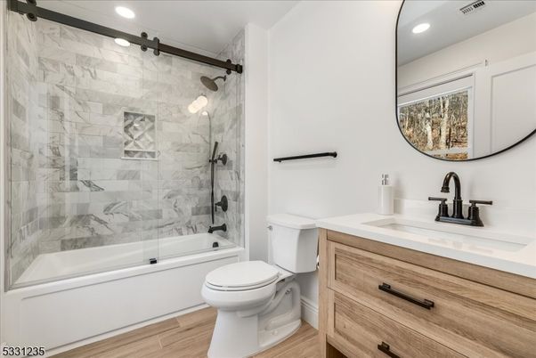 Bathroom, Glass Shower, Interior, Marble Walls, Recessed Lighting, Wood Texture Flooring