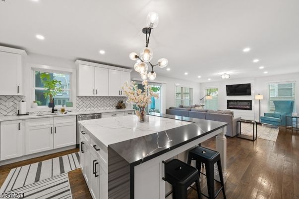 Fireplace, Interior, Kitchen, Living room, Pendant Lights, Recessed Lighting, Stainless Steel Appliances, Wood Texture Flooring