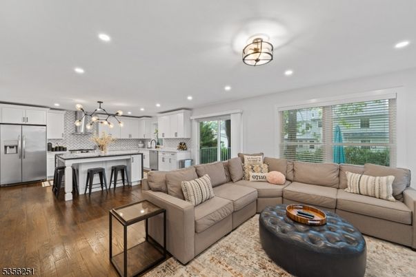 Dining room, Interior, Kitchen, Living room, Pendant Lights, Recessed Lighting, Stainless Steel Appliances, Wood Texture Flooring