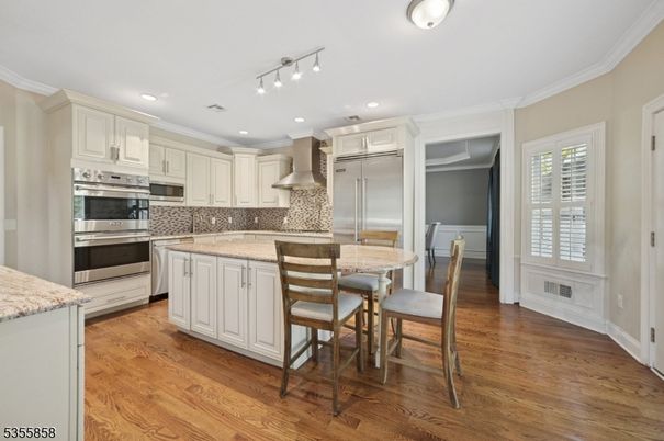 Dining room, Interior, Kitchen, Recessed Lighting, Stainless Steel Appliances, Wood Texture Flooring