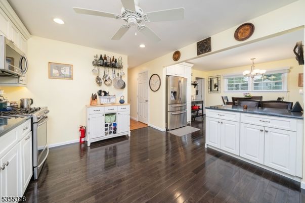Chandelier, Dining room, Interior, Kitchen, Recessed Lighting, Stainless Steel Appliances, Wood Texture Flooring