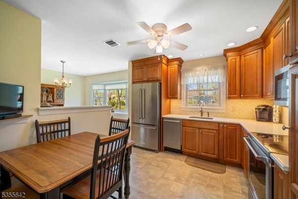 Chandelier, Dining room, Interior, Kitchen, Recessed Lighting, Stainless Steel Appliances