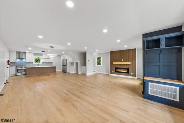 Fireplace, Interior, Kitchen, Recessed Lighting, Stainless Steel Appliances, Wood Texture Flooring