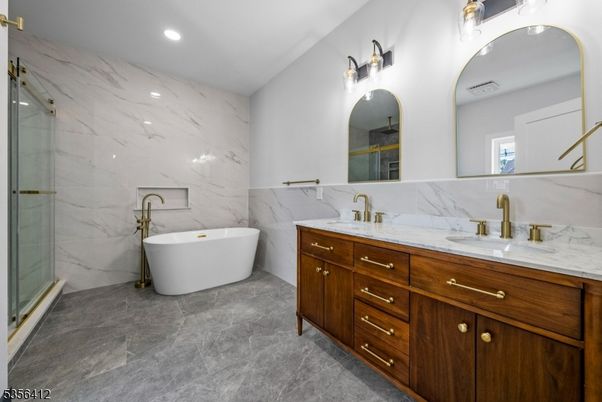Bathroom, Dual Sink Vanities, Free Standing Baths, Glass Shower, Interior, Marble Walls, Recessed Lighting